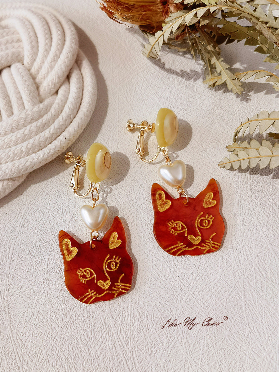 Boucles d'oreilles or rose en forme de cerceau ou de pampille avec un chat mignon