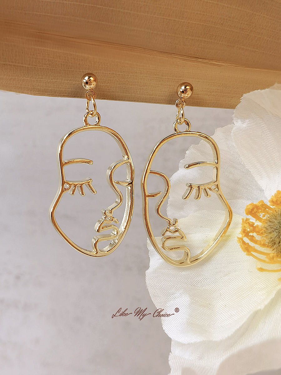 Boucles d'oreilles pampilles visage humain abstrait