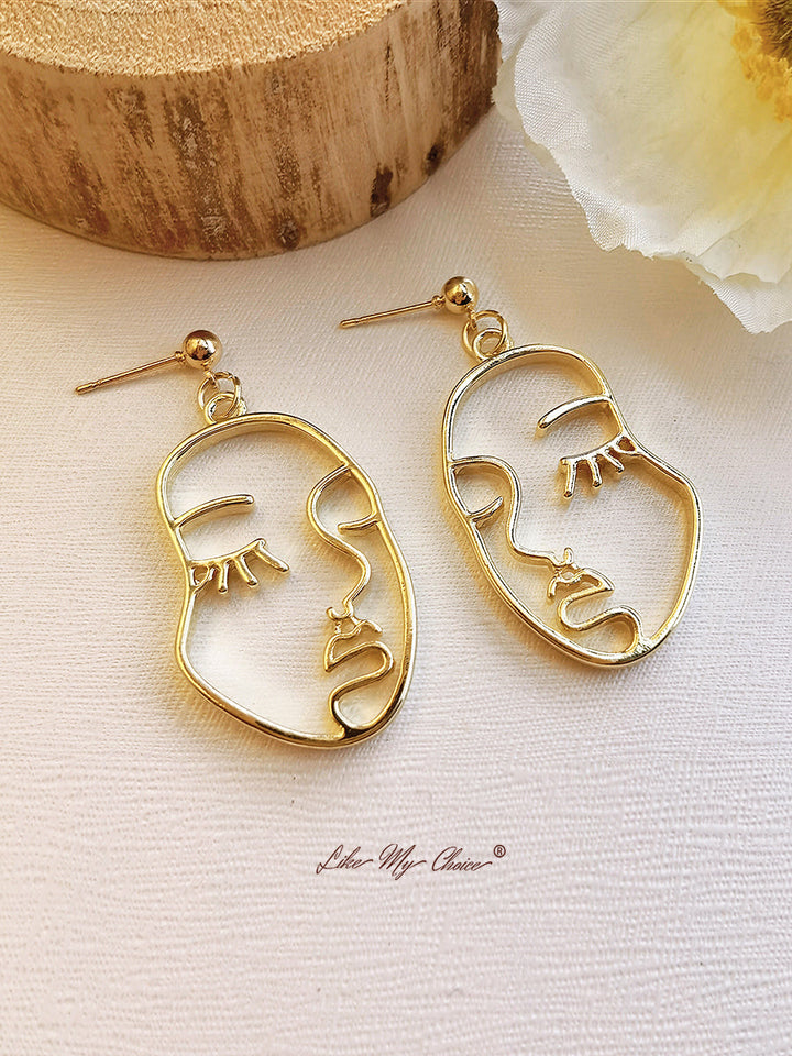 Boucles d'oreilles pampilles visage humain abstrait