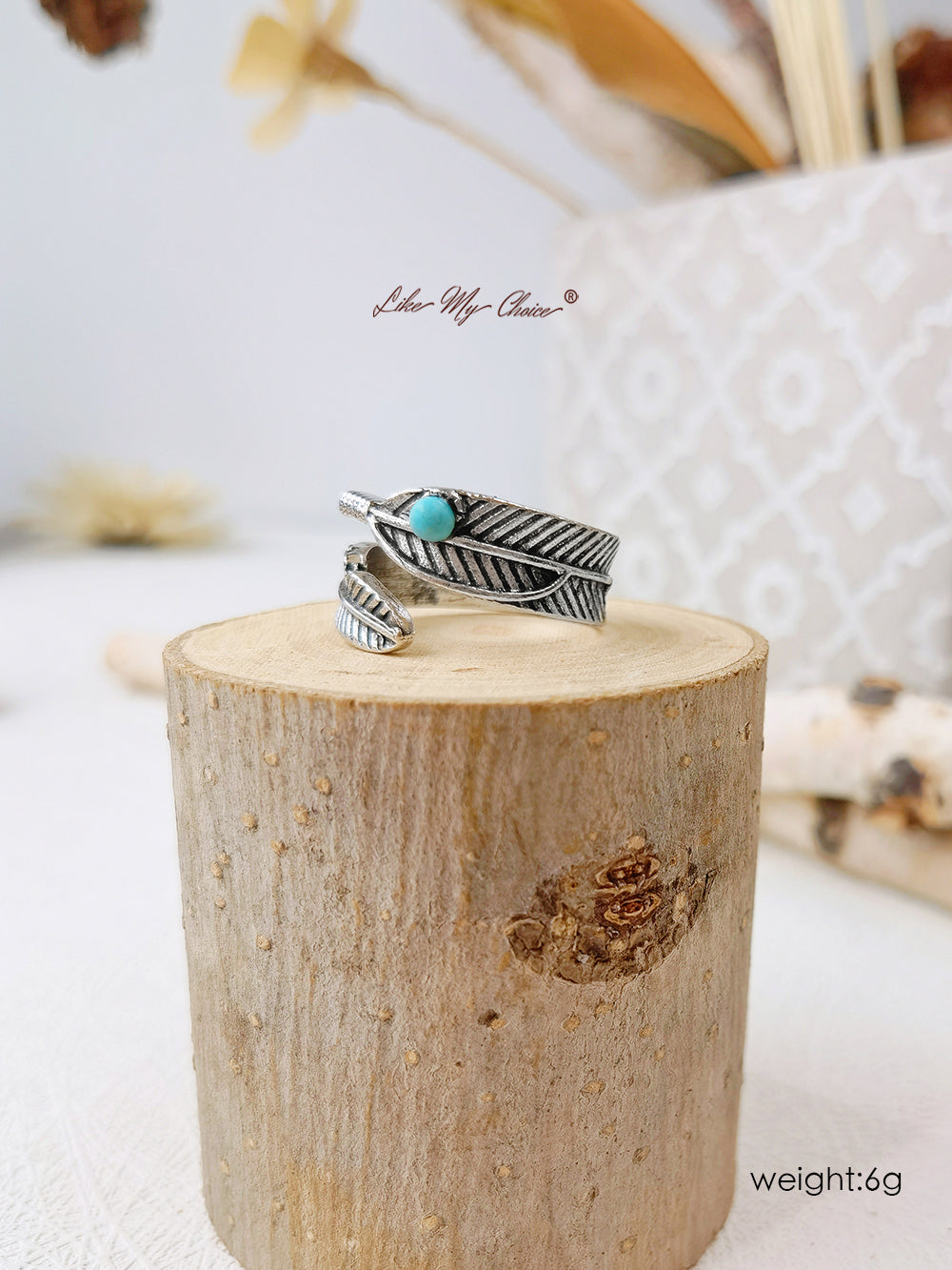 Anillo de plata boho con banda de turquesa y plumas