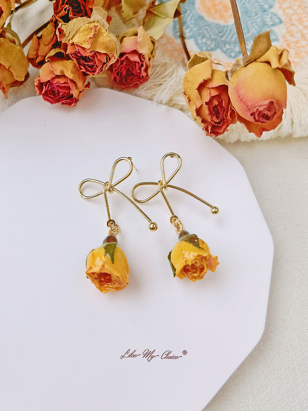 Boucles d'oreilles fleurs séchées noeud rose