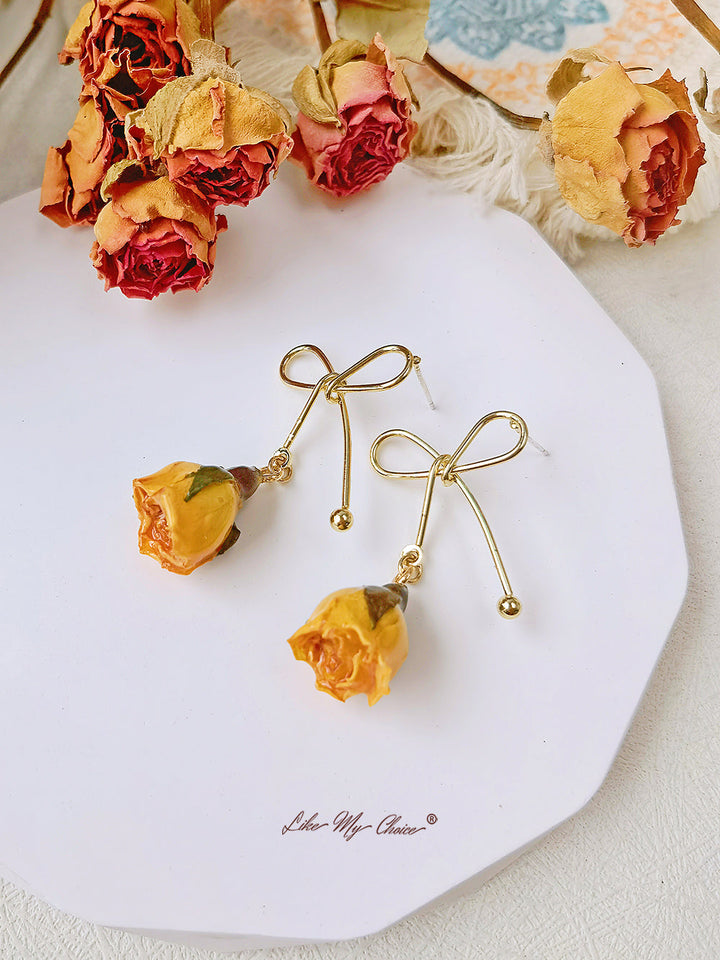 Boucles d'oreilles fleurs séchées noeud rose