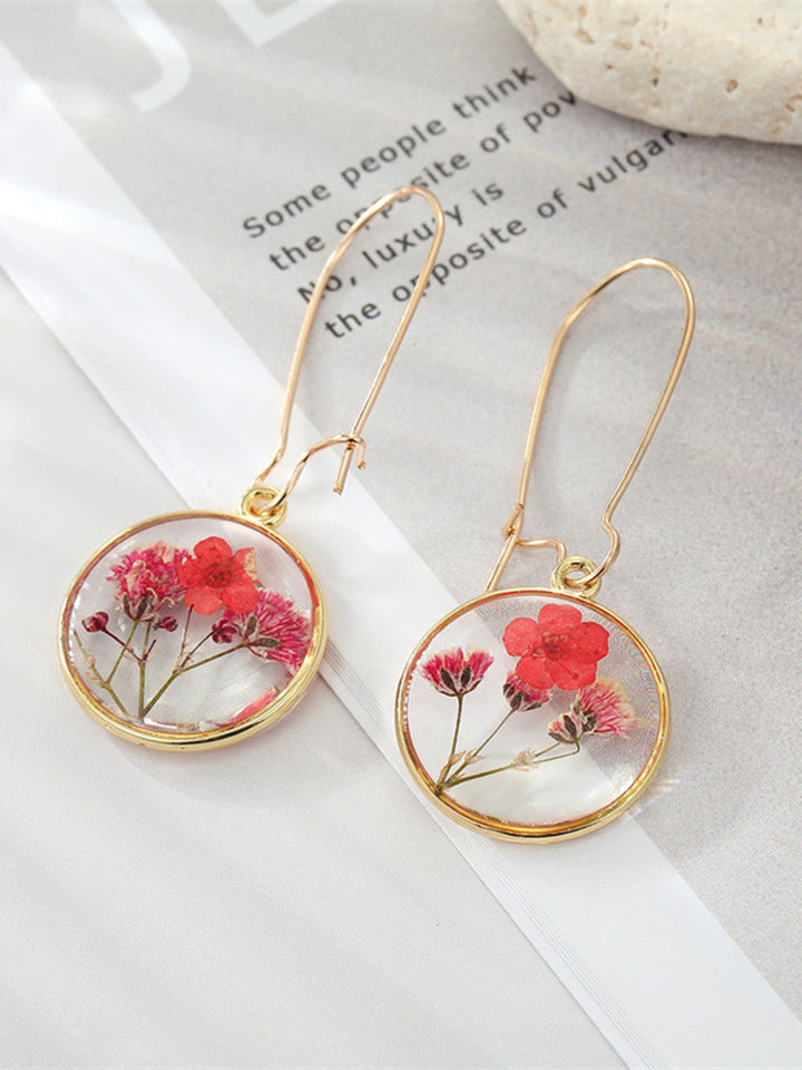 Pendientes boho de resina con flor preservada